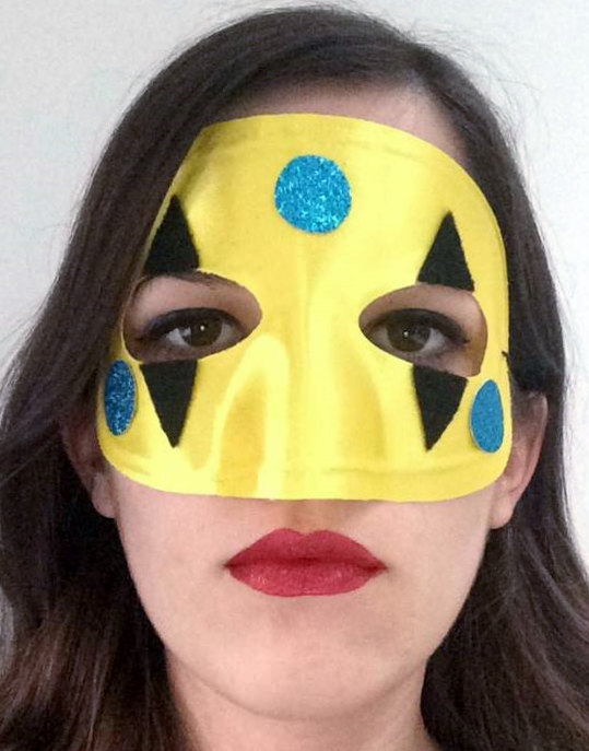 A woman wearing a My Chemical Romance Harlequin mask