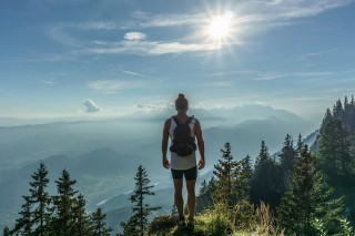 A backpacker looks over mountains