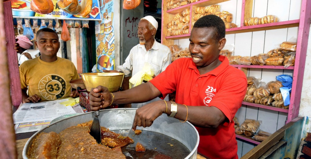 Three Somalis in prepare food in Mogadishu