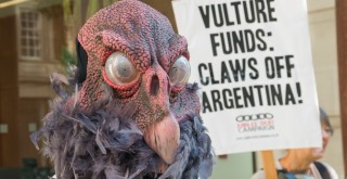 Vulture mask and placard at Jubilee Debt Campaign protest in solidarity on Argentinian Independence day.