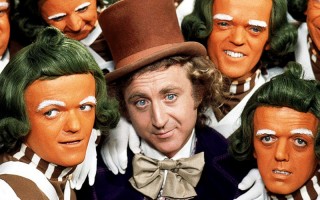 Willy Wonka (Gebe Wilder) poses with the Oompa Loompas