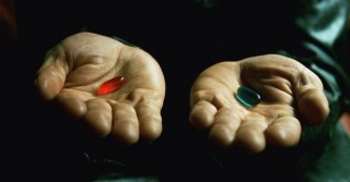 A pair of hands, one holds a blue pill, the other a red pill