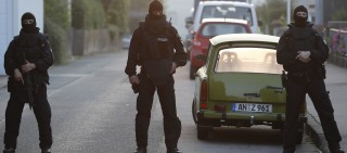 Special police officers secure a street near the house where a Syrian man lived before the explosion in Ansbach, southern Germany on July 25, 2016.