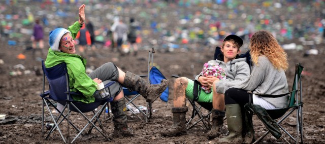 Festival goers in the aftermath of Glastonbury Festival, at Worthy Farm in Somerset.