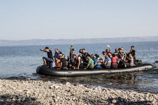 Refugees arrive on a boat in Lesbos, Greece.
