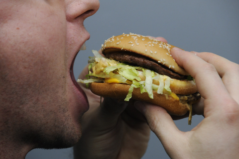 A man eating a Big Mac