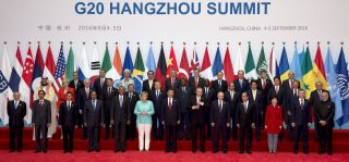 State leaders take part in a group photo session for the G20 Summit in China