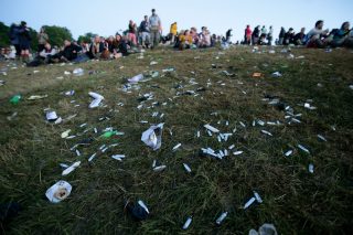 Discarded nitrus oxide capsules litter the ground at Glastonbury