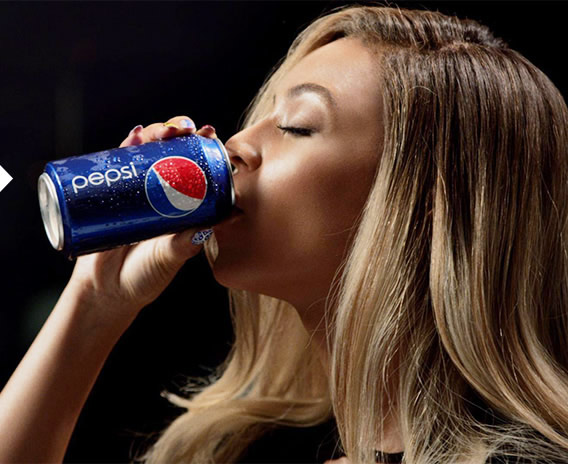 Beyonce drinking a can of Pepsi