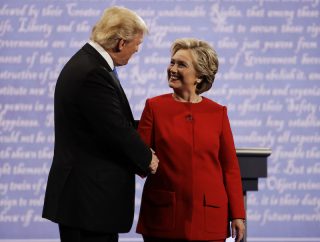 Hillary Clinton shakes hands with Donald Trump