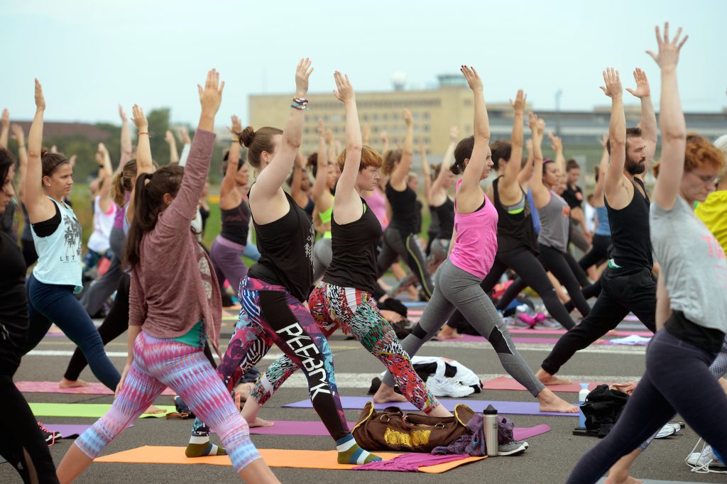 A yoga class takes places in Tempelhof, Berlin.
