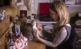 Ruth paints a stuffed squirrel