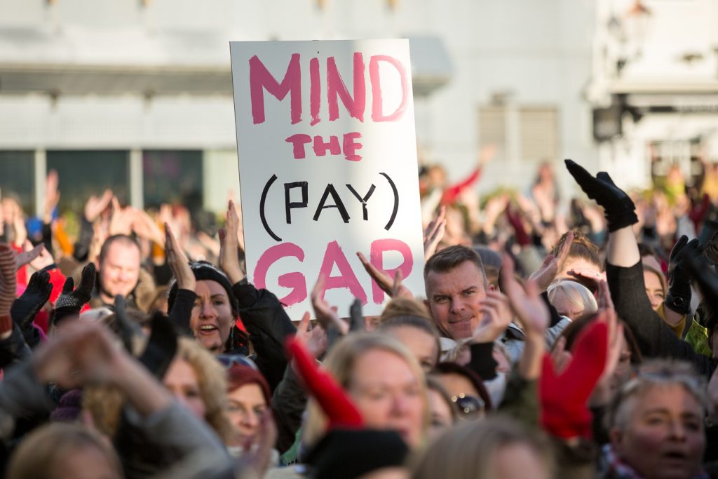 Protester with sign reading 