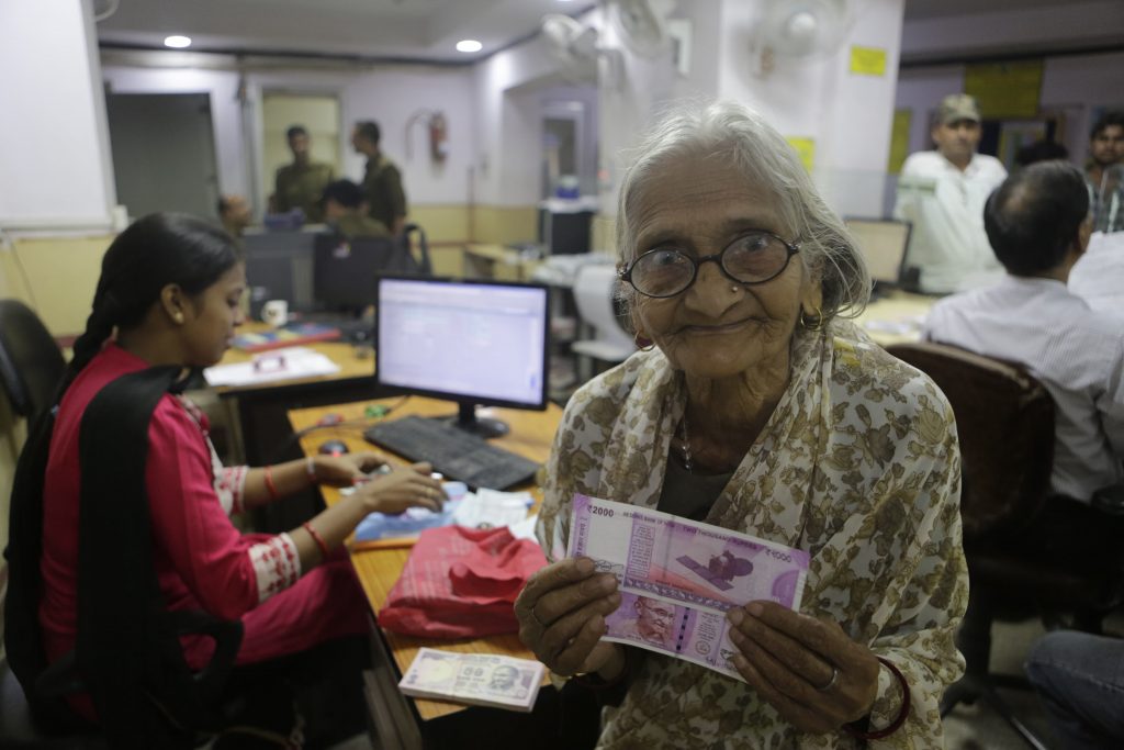 Indian woman holding new money