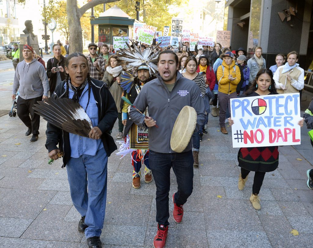 Protesters march in protest against the Dakota Access pipeline.