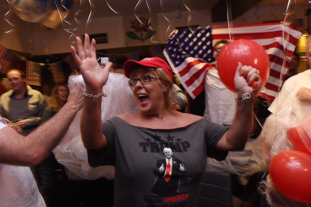 A Trump supporter celebrates his victory.