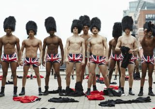 Photos of men dressed like Royal Queen's Guards in Union Jack underwear