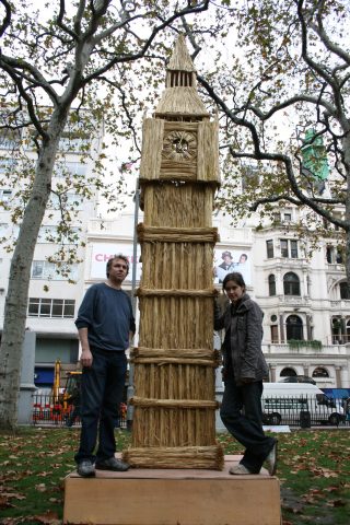Artist with Big Ben made of wheat