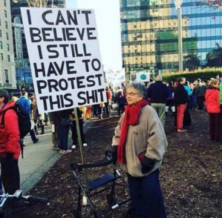 Protester saying 'I can't believe I still have to protest this shit'