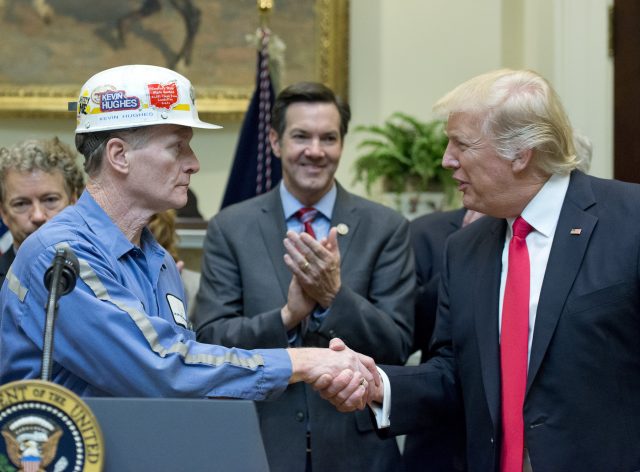 Trump shakes hands with coal miner in the White House. Feb 2017.