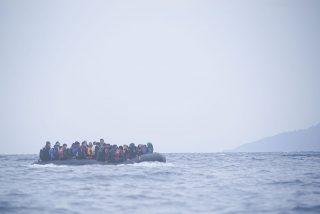 Refugees_on_a_boat_crossing_the_Mediterranean_sea,_heading_from_Turkish_coast_to_the_northeastern_Greek_island_of_Lesbos,_29_January_2016