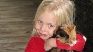 Blond Kitten Girl Smiling Young Hugging Child