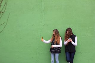 silly-teenage-millennials-having-fun-snapping-selfie-photos-of-wind-blown-hair-looks-with-mobile_t20_neVBYn