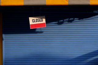 closed-shop-label-notice-sun-blind-grocery-store-shutter-door-sunlight-and-shadow-closed-sign-board_t20_0x7Jw2