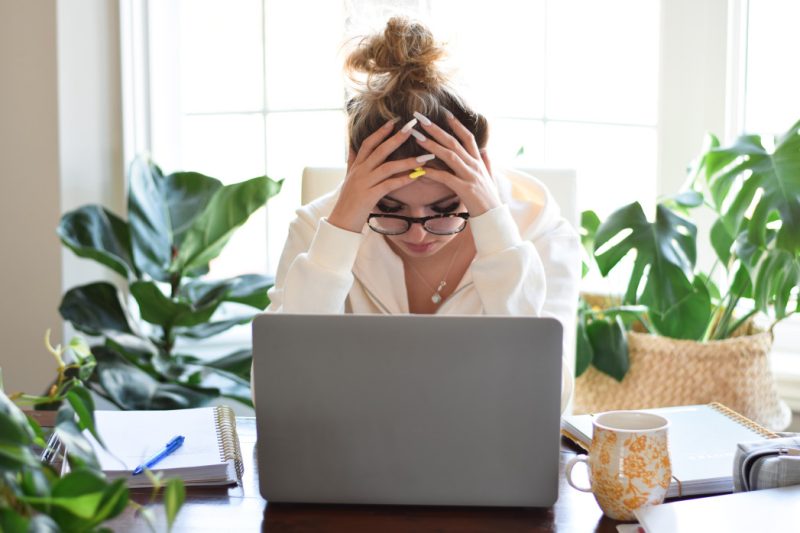 Girl stressed out looked at her laptop