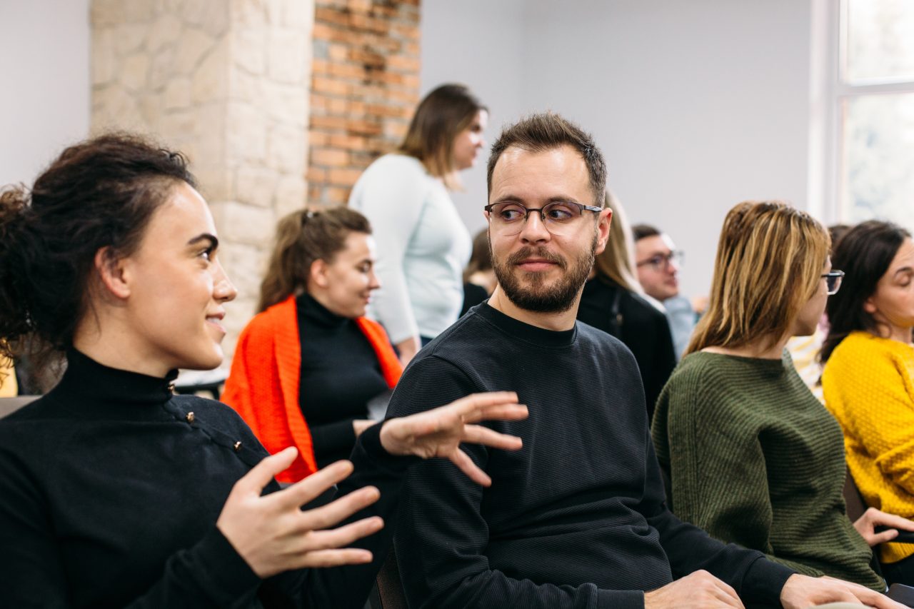 Young people talking with each other.