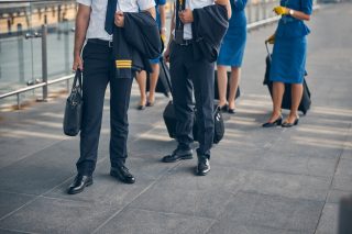 Pilots and flight attendants standing on the street