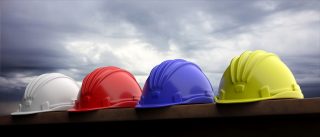 Safety hard hats on grey sky background, 3d illustration